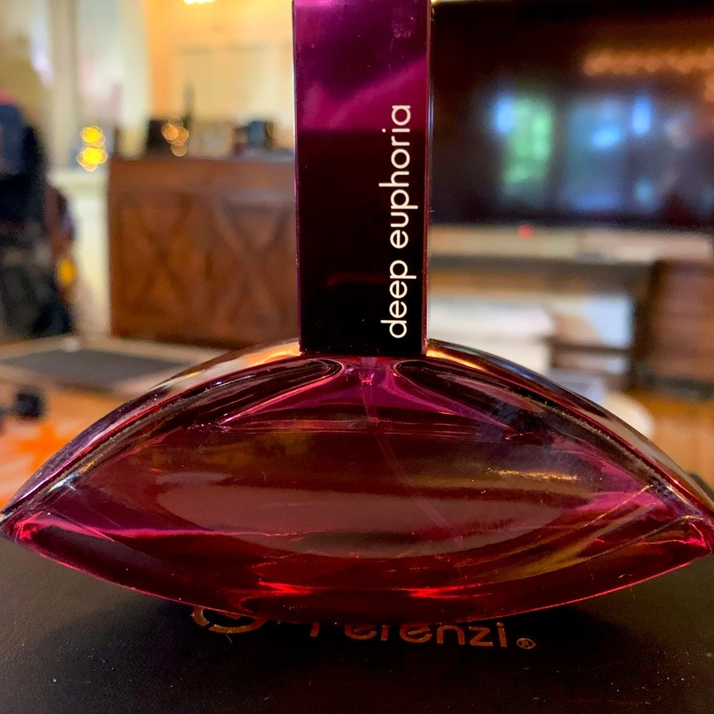 Deep Euphoria by Calvin Klein. 1.7 oz, 95% full.